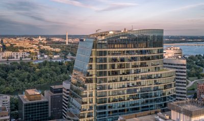 photo of building taken by drone with DC in the background
